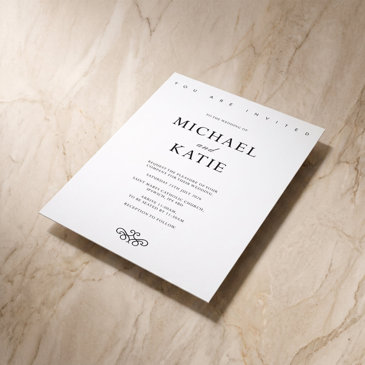 Essential wedding invitation, shown at an angle, designed and printed in Suffolk