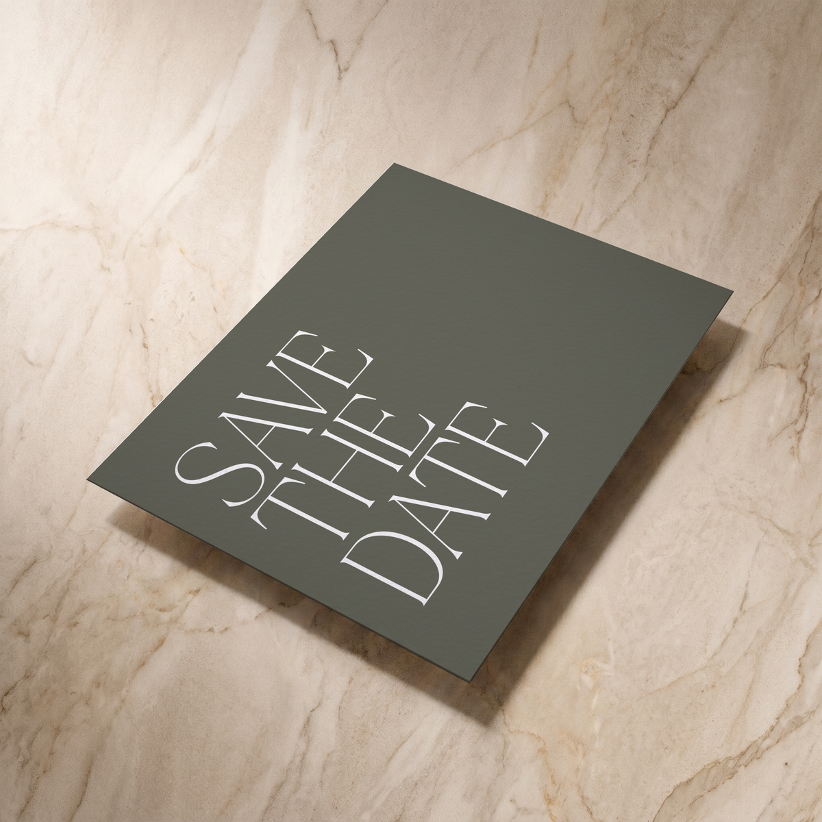 Typeface save the date card in forest green, reverse shown at an angle, designed and printed in Suffolk