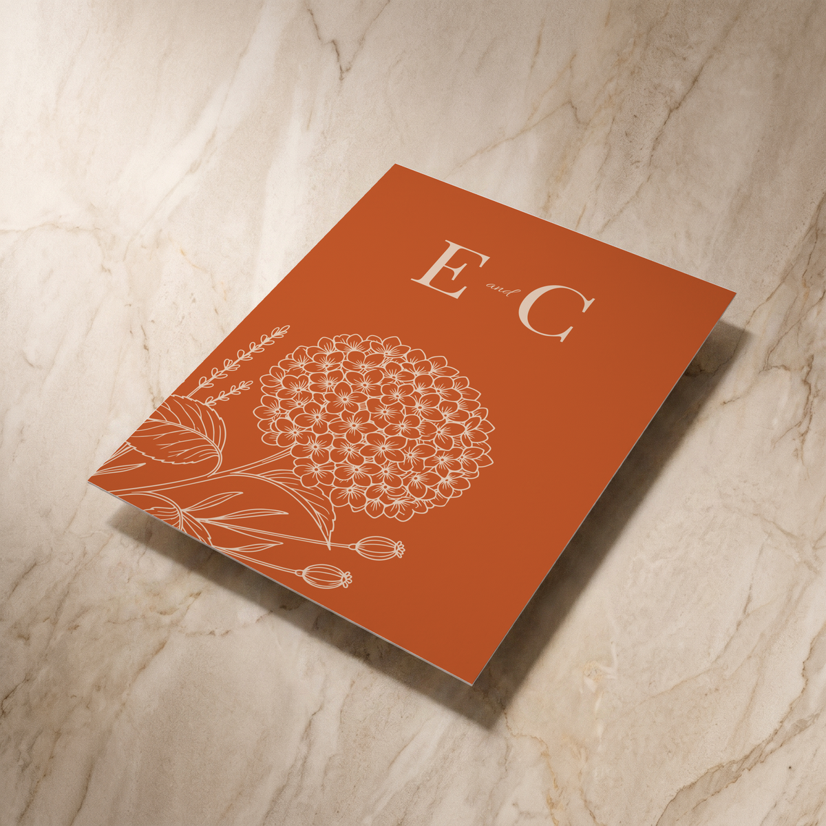 Hydrangea wedding invitation, reverse shown at an angle, designed and printed in Suffolk