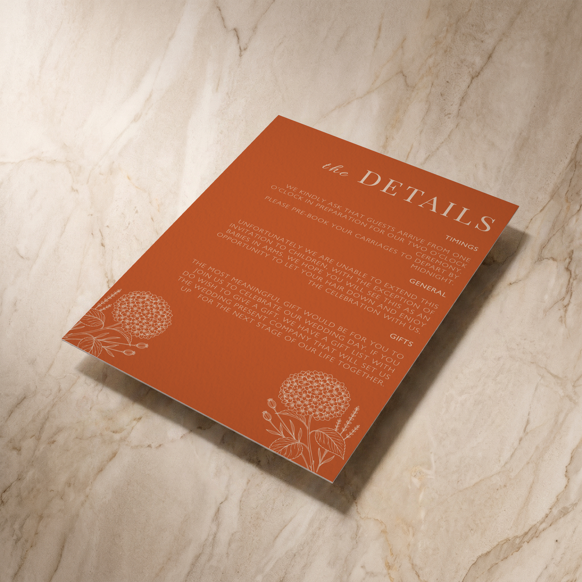Hydrangea wedding details card, shown at an angle, designed and printed in Suffolk