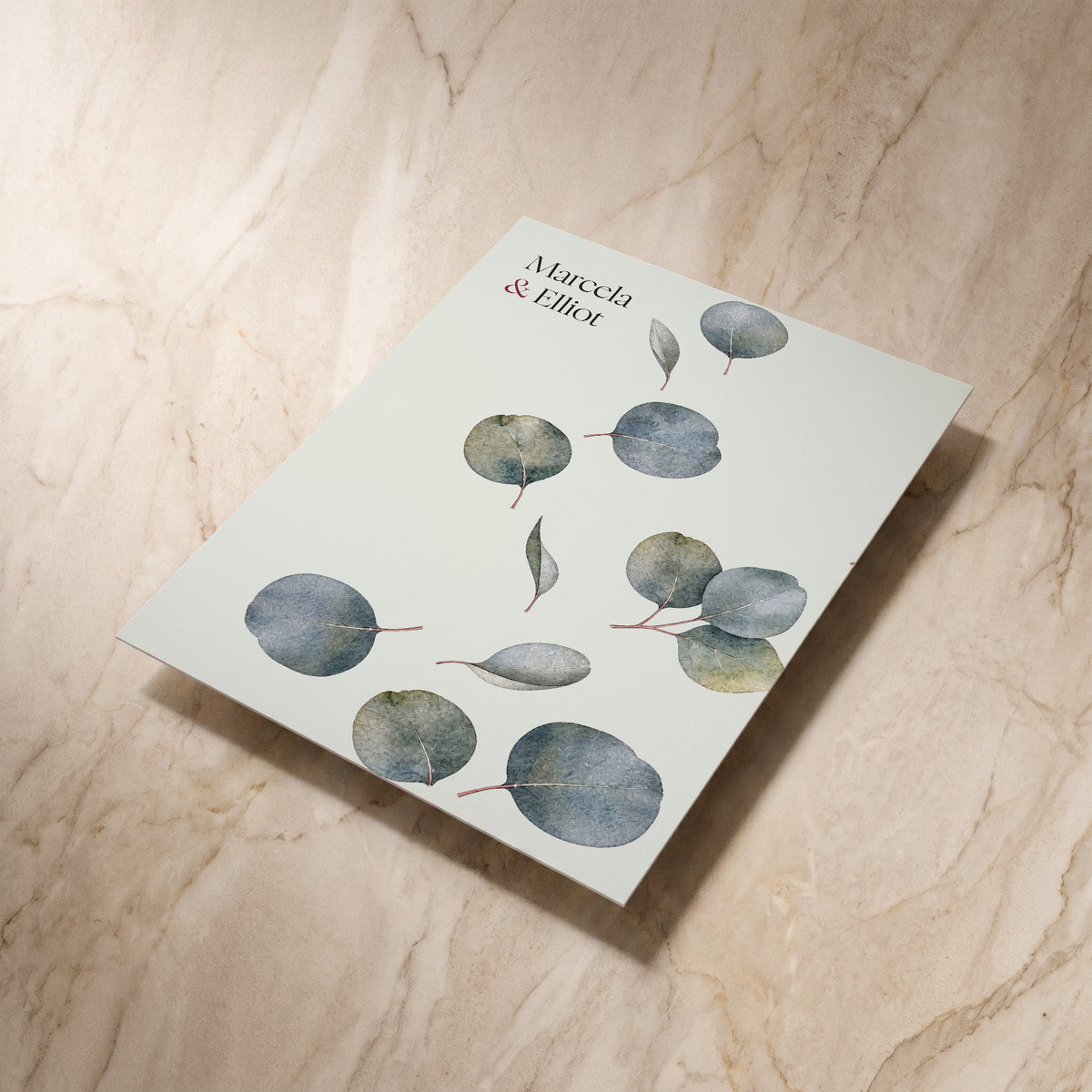 Eucalyptus wedding save the date card, reverse shown at an angle, designed and printed in Suffolk