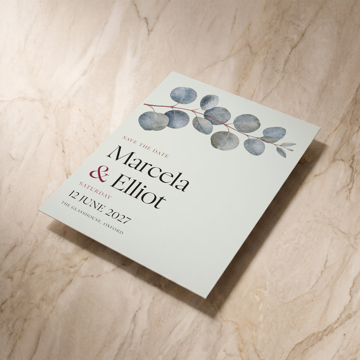 Eucalyptus wedding save the date card, shown at an angle, designed and printed in Suffolk