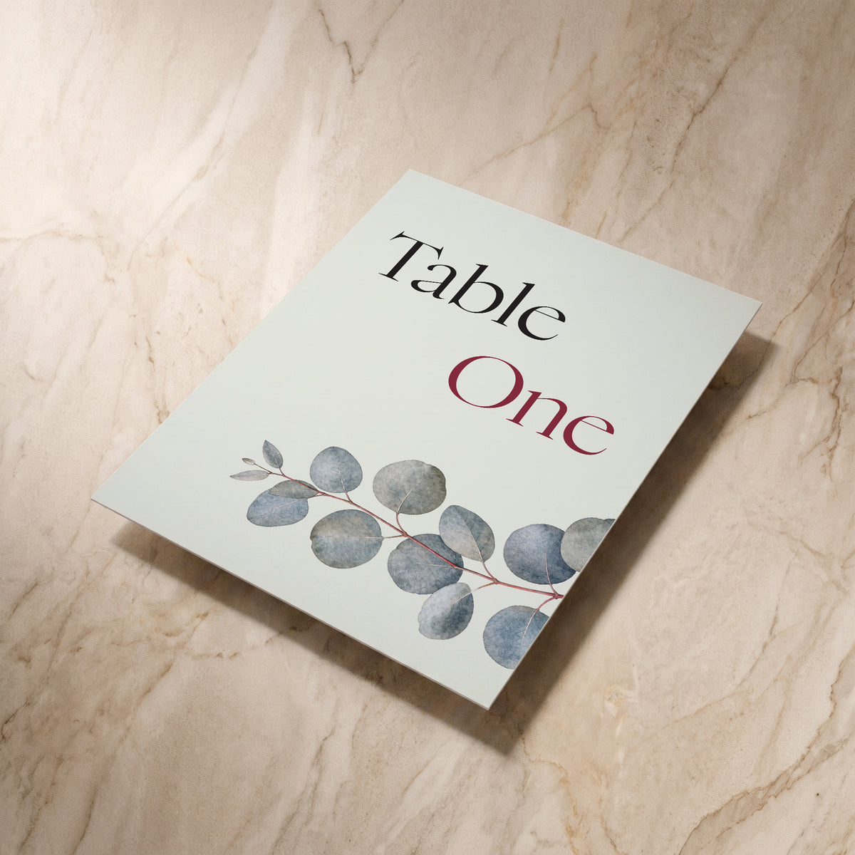 Eucalyptus wedding table number, shown at an angle, designed and printed in Suffolk