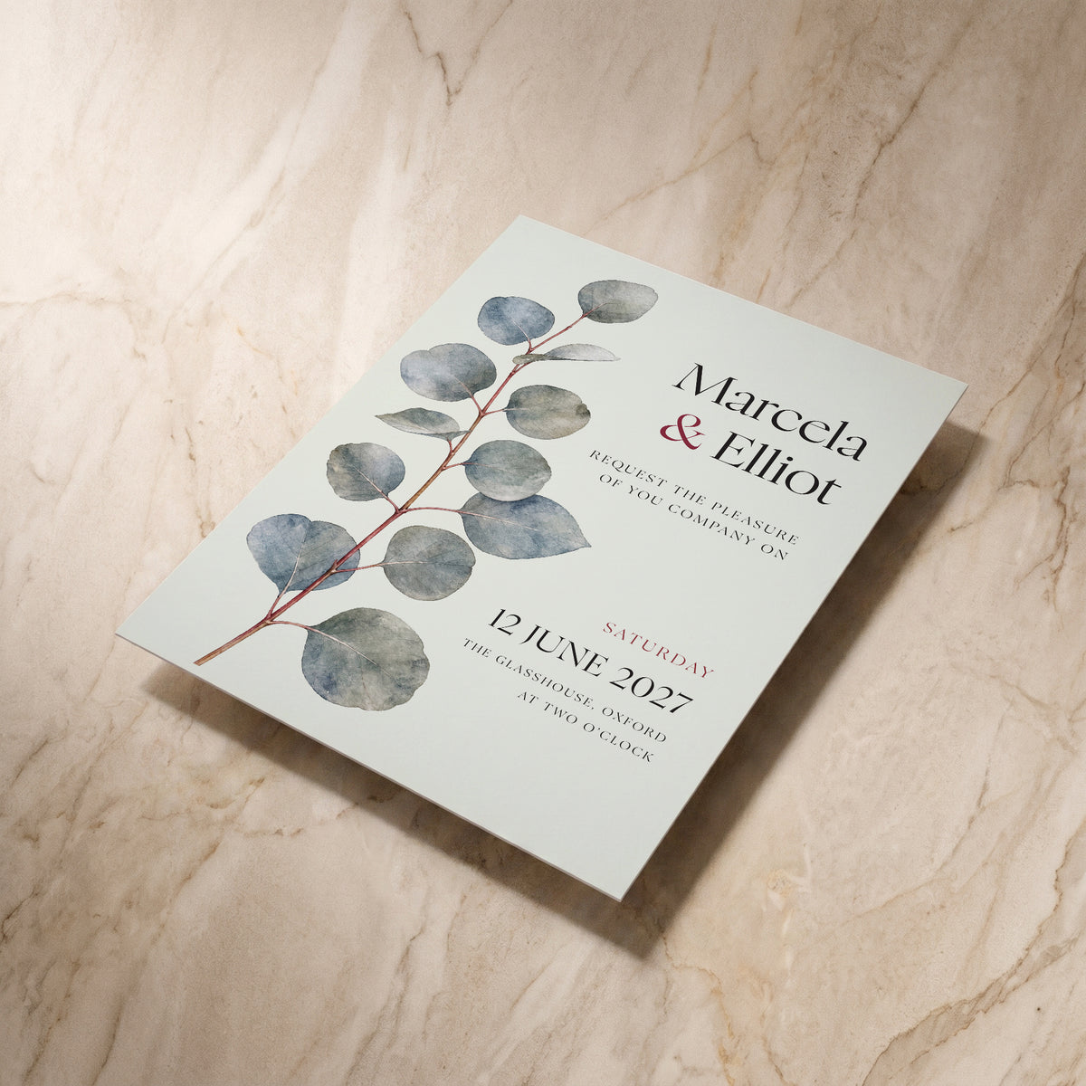 Eucalyptus wedding invitation, shown at an angle, designed and printed in Suffolk