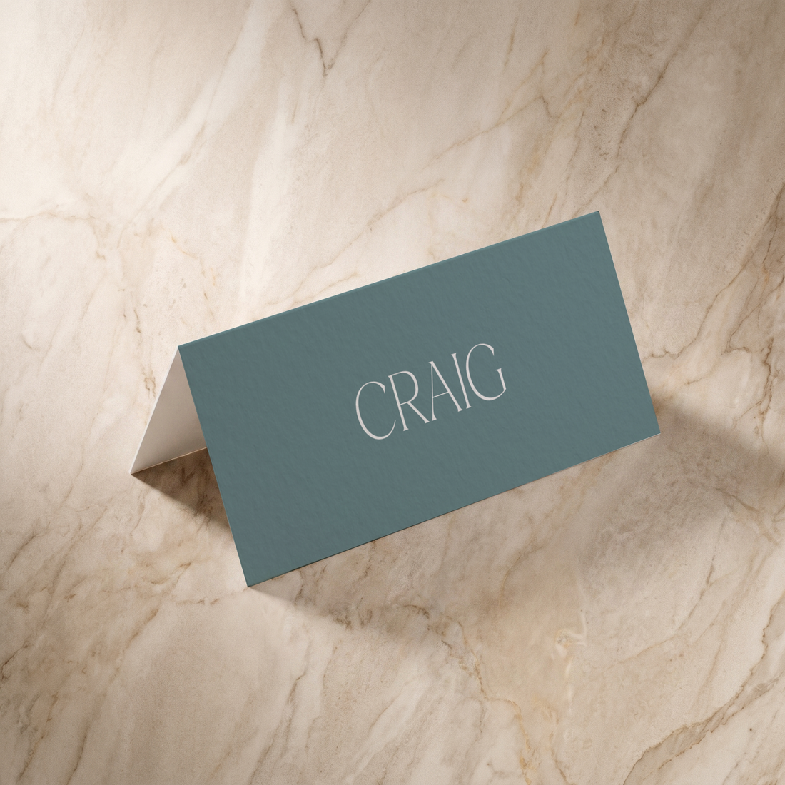 Typeface place card in powder blue, front design, designed and printed in Suffolk
