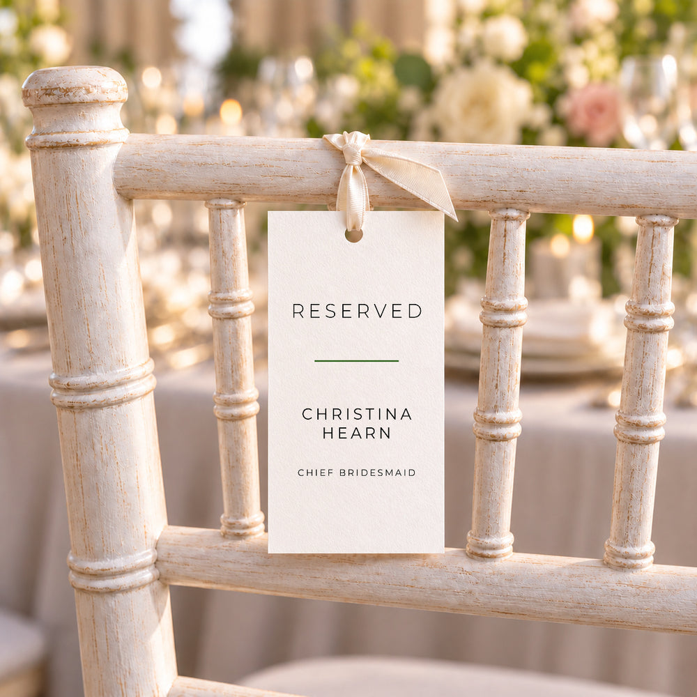 Simplicity wedding reserved tag tied to a chair back